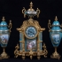 Sèvres Gilt Bronze & Porcelain Garniture Set: 1 Mantle clock + 2 Urns.